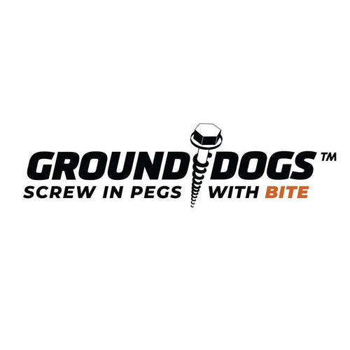 Logo with the text GROUND DOGS™ SCREW IN PEGS WITH BITE. The O in DOGS is replaced by a graphic of a screw with a hexagonal head. The word BITE is in orange.