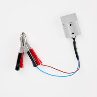 The All power to you bundle features red and black alligator clips linked by brown and blue wires to a gray Anderson plug, all set against a white background.