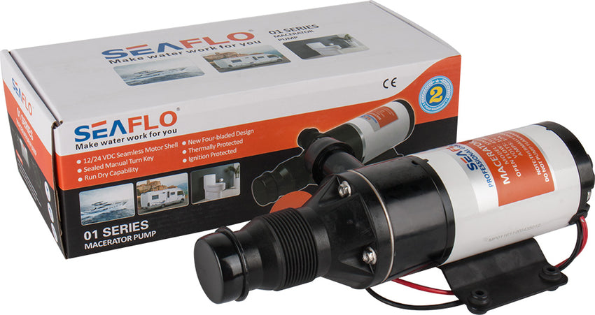 The Seaflo 01-Series Marine Macerator Pump, featuring a four-blade chopper, is shown in front of its branded box. This black pump has a white and orange label, visible wiring, and suits marine and RV waste systems.