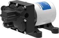 The Seaflo 12V RV Supreme Pump is a quiet black and white water pump with a mounting base, visible screws, two hose connections, and a side label. It's designed for fluid transfer applications in RVs.