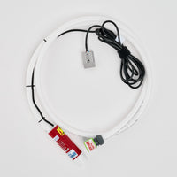 The Adventure Pumps Essentials Pump Kit – Power Accessory Compatible features a white coiled flexible tube, red-labeled cylinder, gray metal connector, and black cable with Anderson Plug—ideal for water transfer.