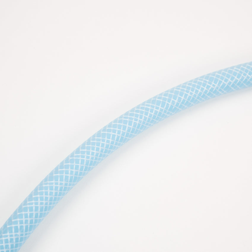 The 1 x 5 meter extension hose with fittings, featuring a light blue color and white crisscross pattern, is shown curving against a plain white background—ideal for use with Adventure Pumps hose connectors and water tanks.
