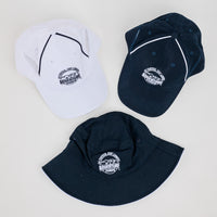 Three hats in white, navy, and black with a logo on a light gray background