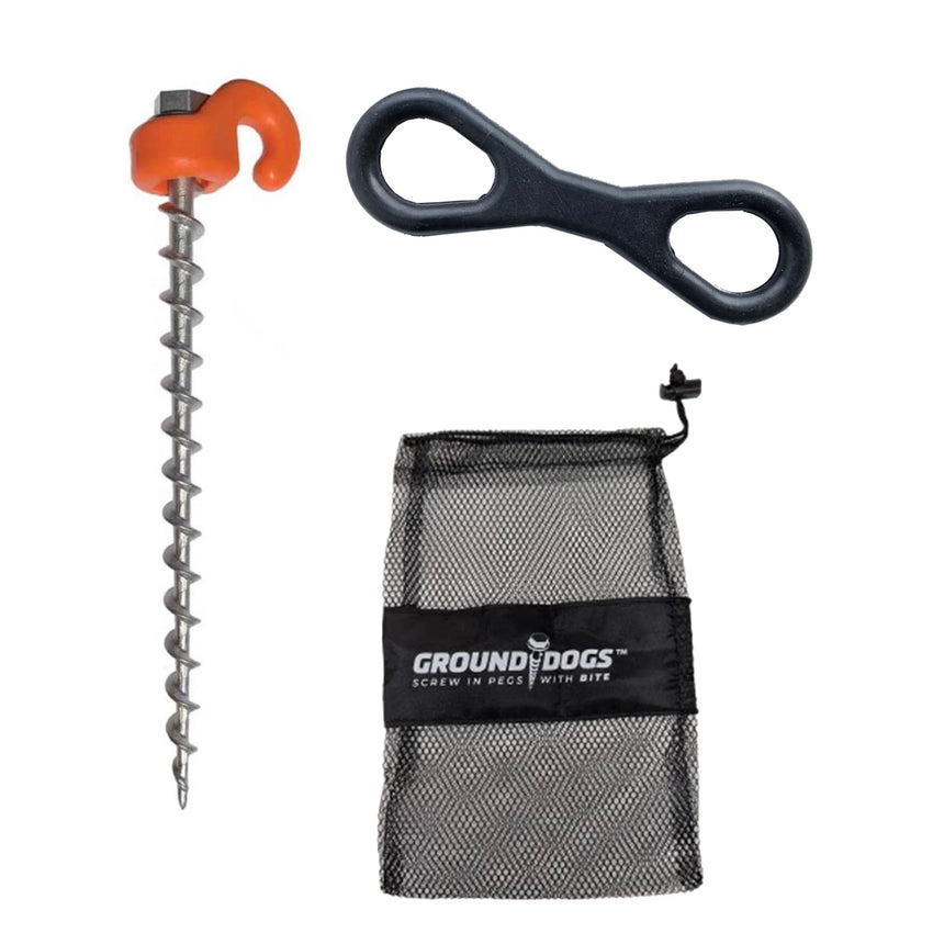 The Pet Restraint Kit includes a metal screw-in peg with an orange handle, a black figure 8 tool, and a mesh pouch labeled "GROUND DOGS SCREW IN PEGS WITH BITE"—perfect for pet safety or caravan park security.