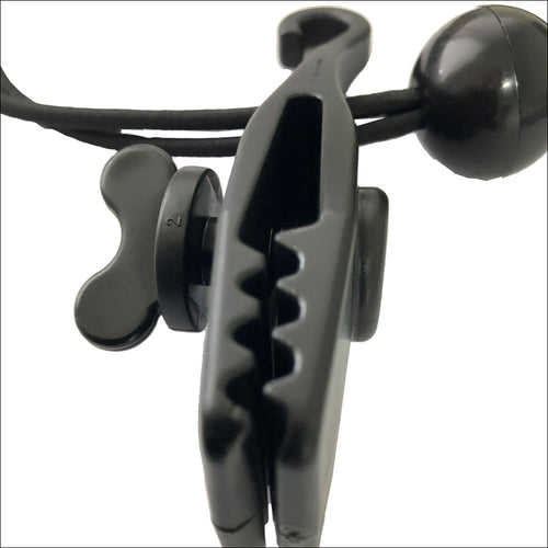Close-up of an Anti Flap Kit – Each, featuring a black plastic clamp with serrated jaws attached to a cord with a round black stopper.