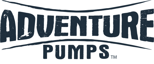 Logo with the words ADVENTURE PUMPS in bold, distressed lettering. The text is stretched horizontally, creating a dynamic, energetic appearance.