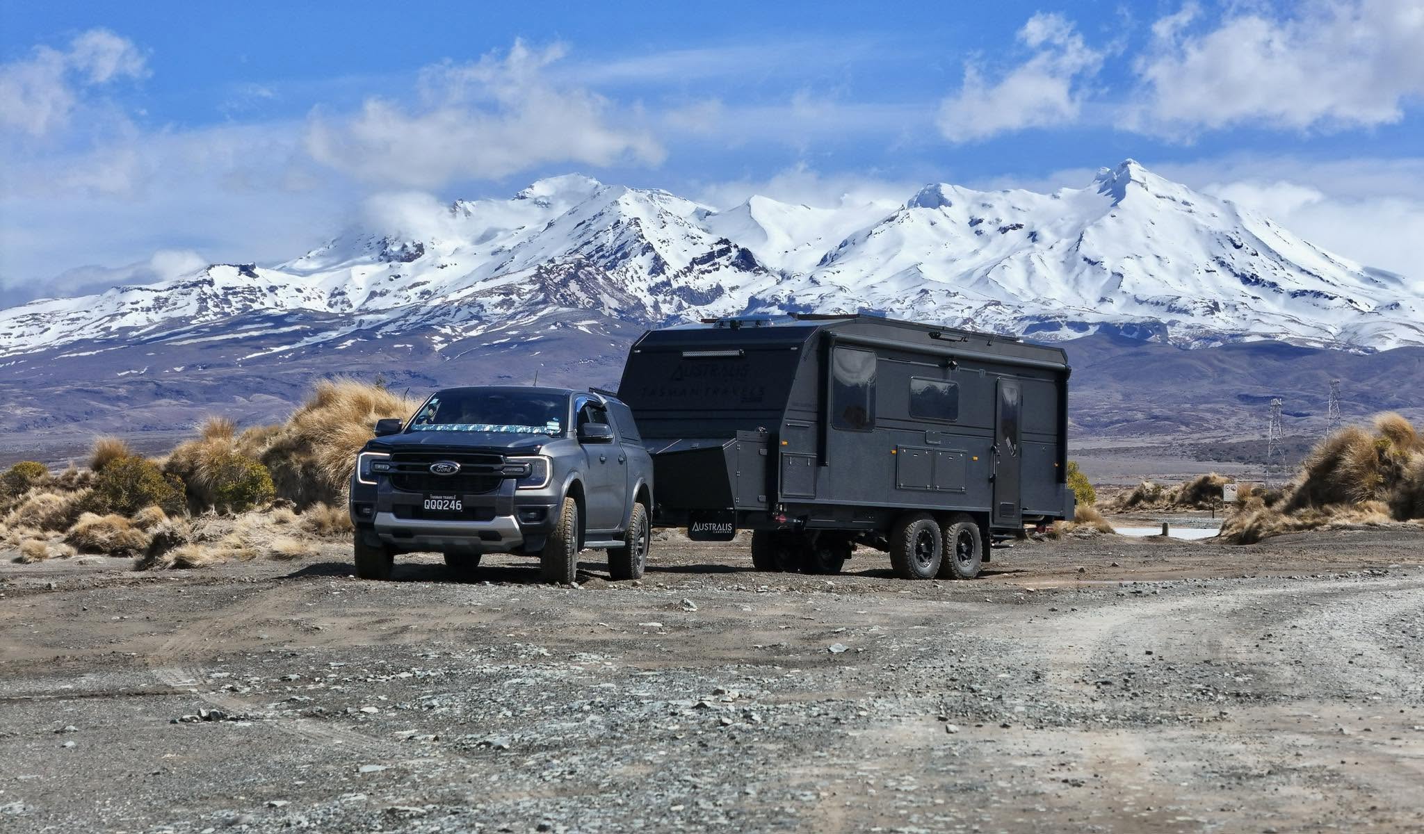 Tasman Travels caravan set up at a New Zealand campsite